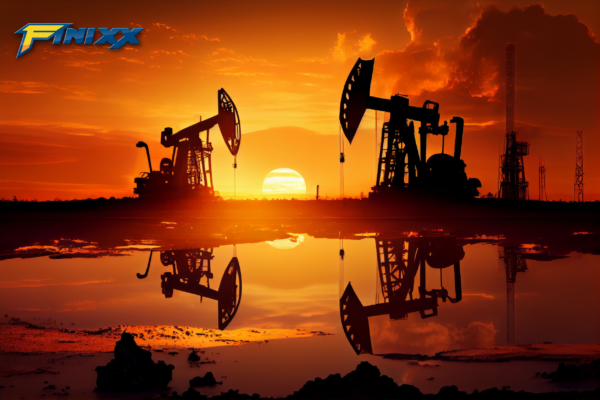 Three oil pumpjacks extracting petroleum at sunset, symbolizing the oil industry and energy production.